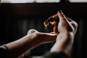 hand holding essential oil