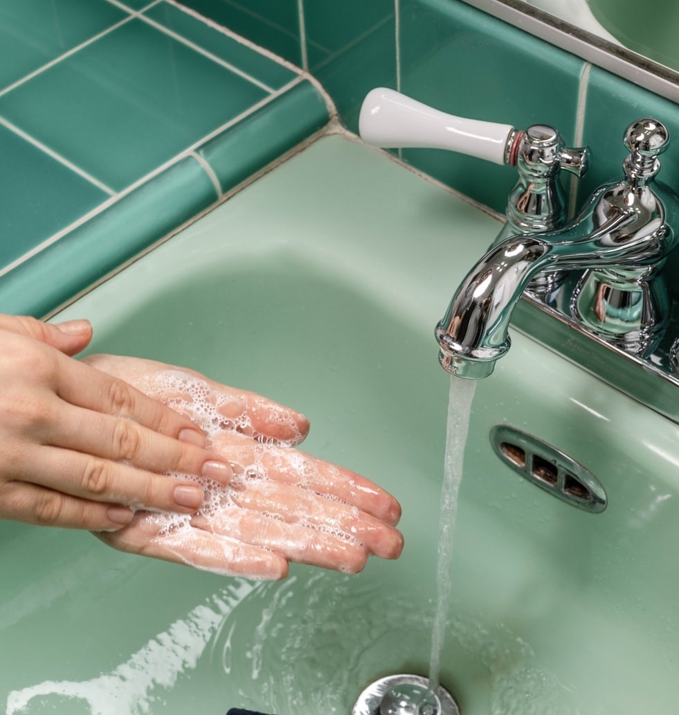 hands washing in sink