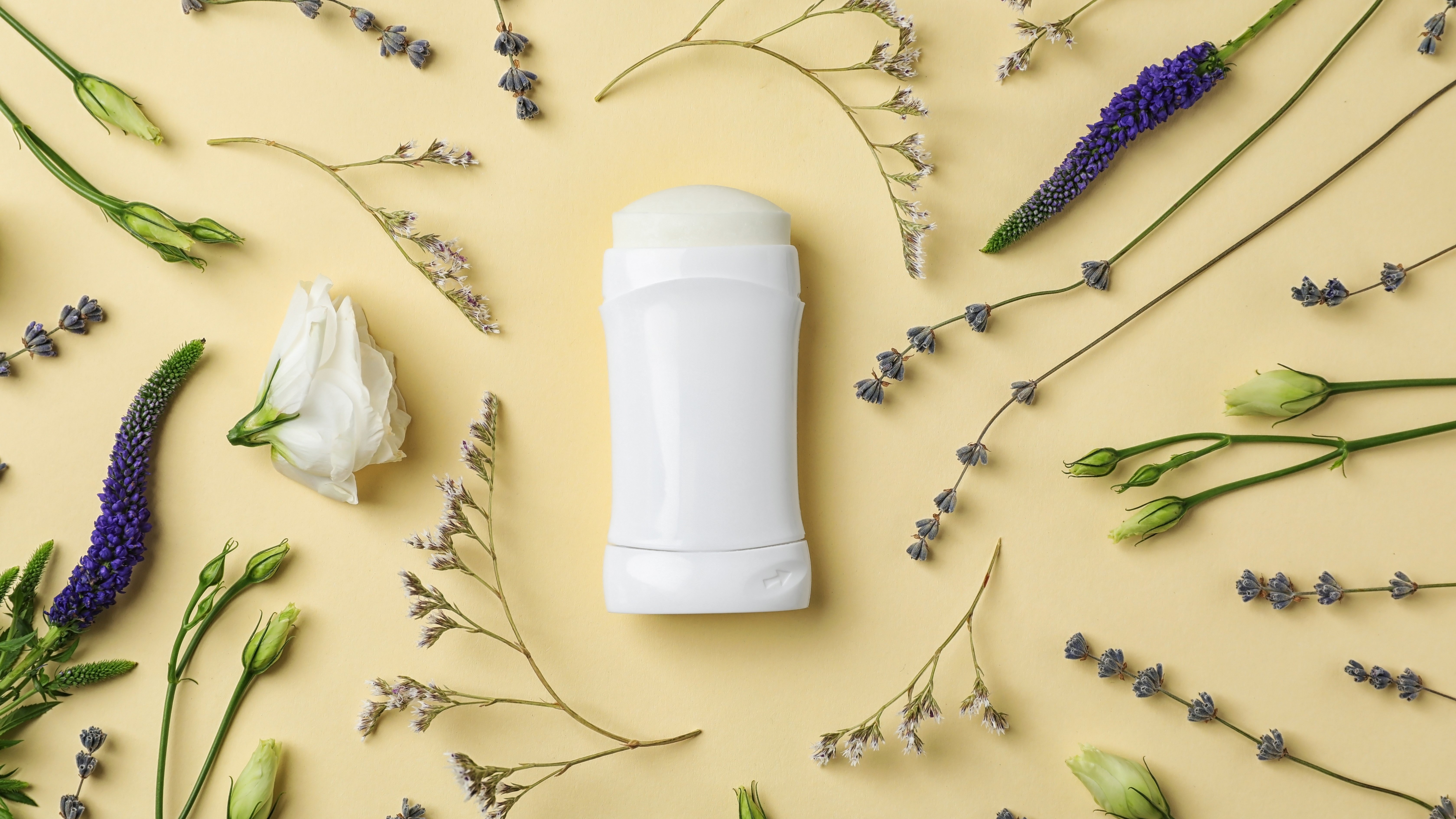 deodorant and floral flat lay