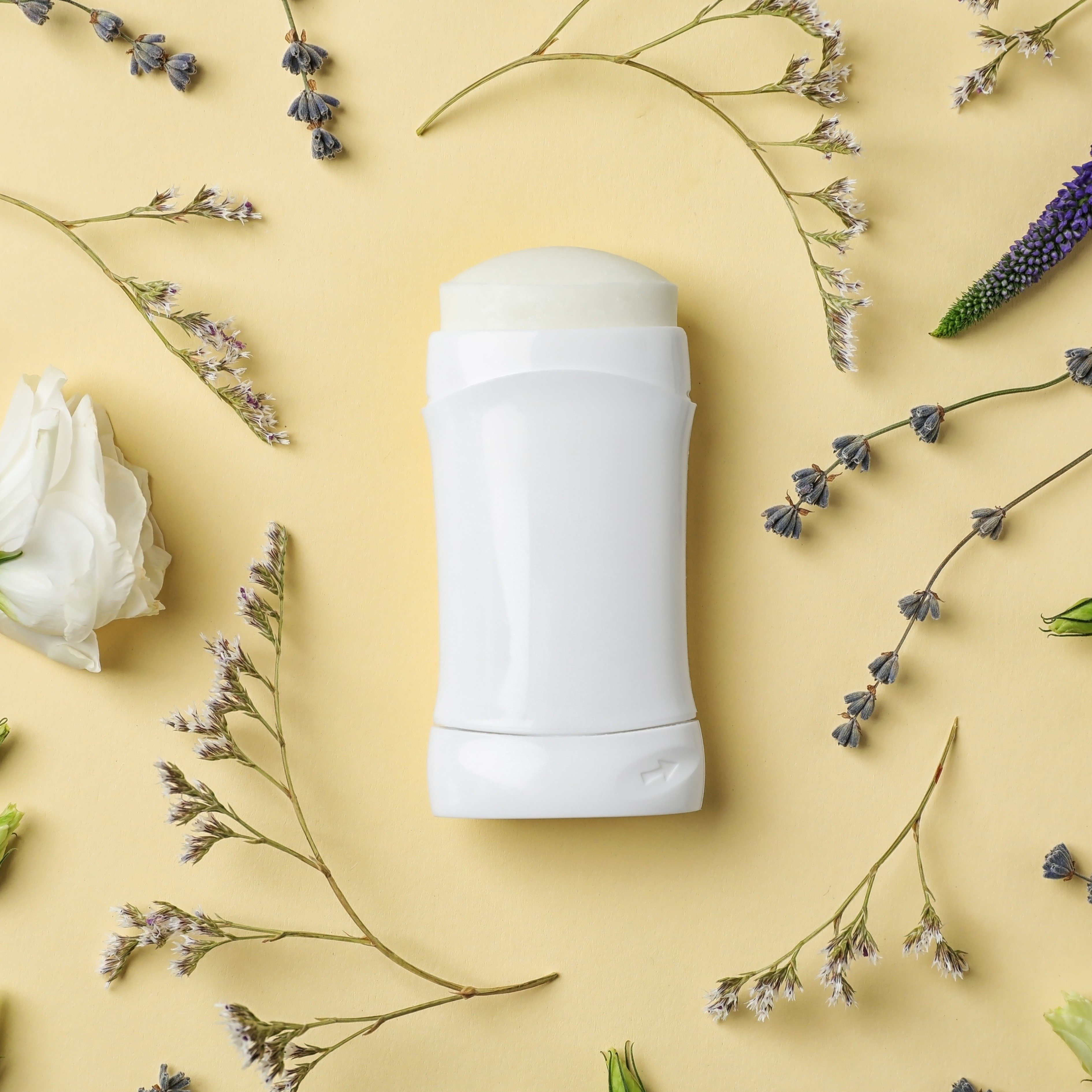 deodorant and flower flatlay - square