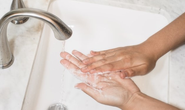 washing handsd at the sink